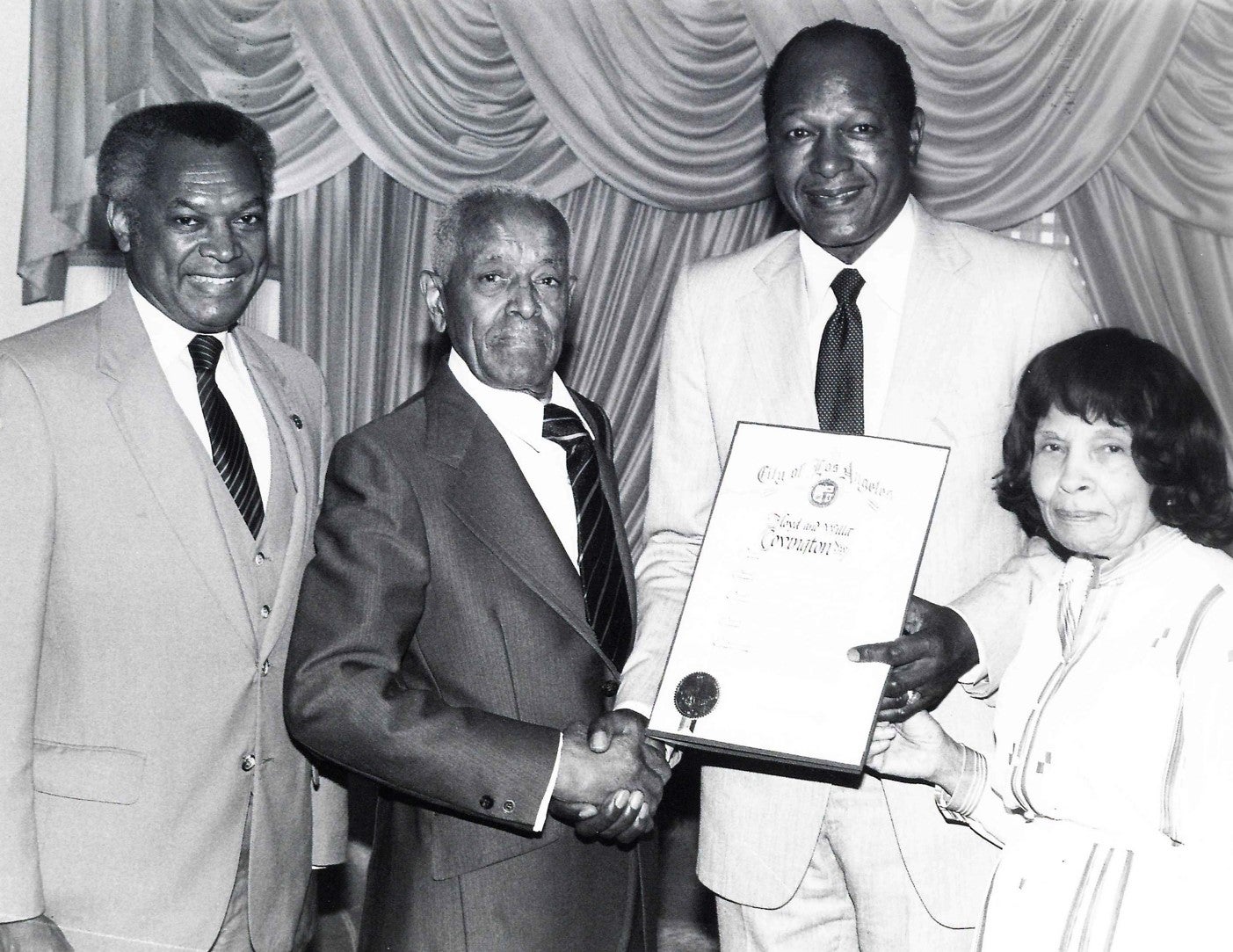 From left: John Mack, Floyd C. Covington, Mayor Tom Bradley, and Alma Covington, 1984