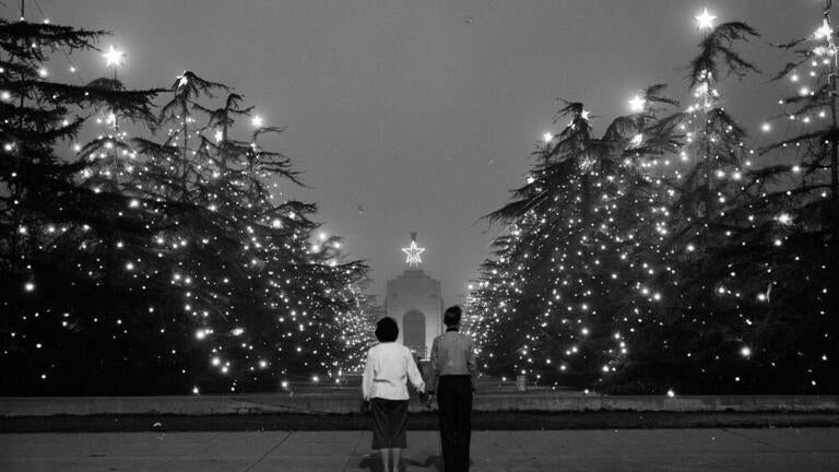 Christmas trees outside the Los Angeles Memorial Coliseum, 1953. Image from the USC Digital Library's Los Angeles Examiner Collection.