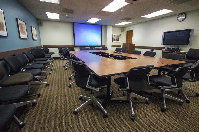 Tables and chairs in the East Conference Room of Norris Medical Library